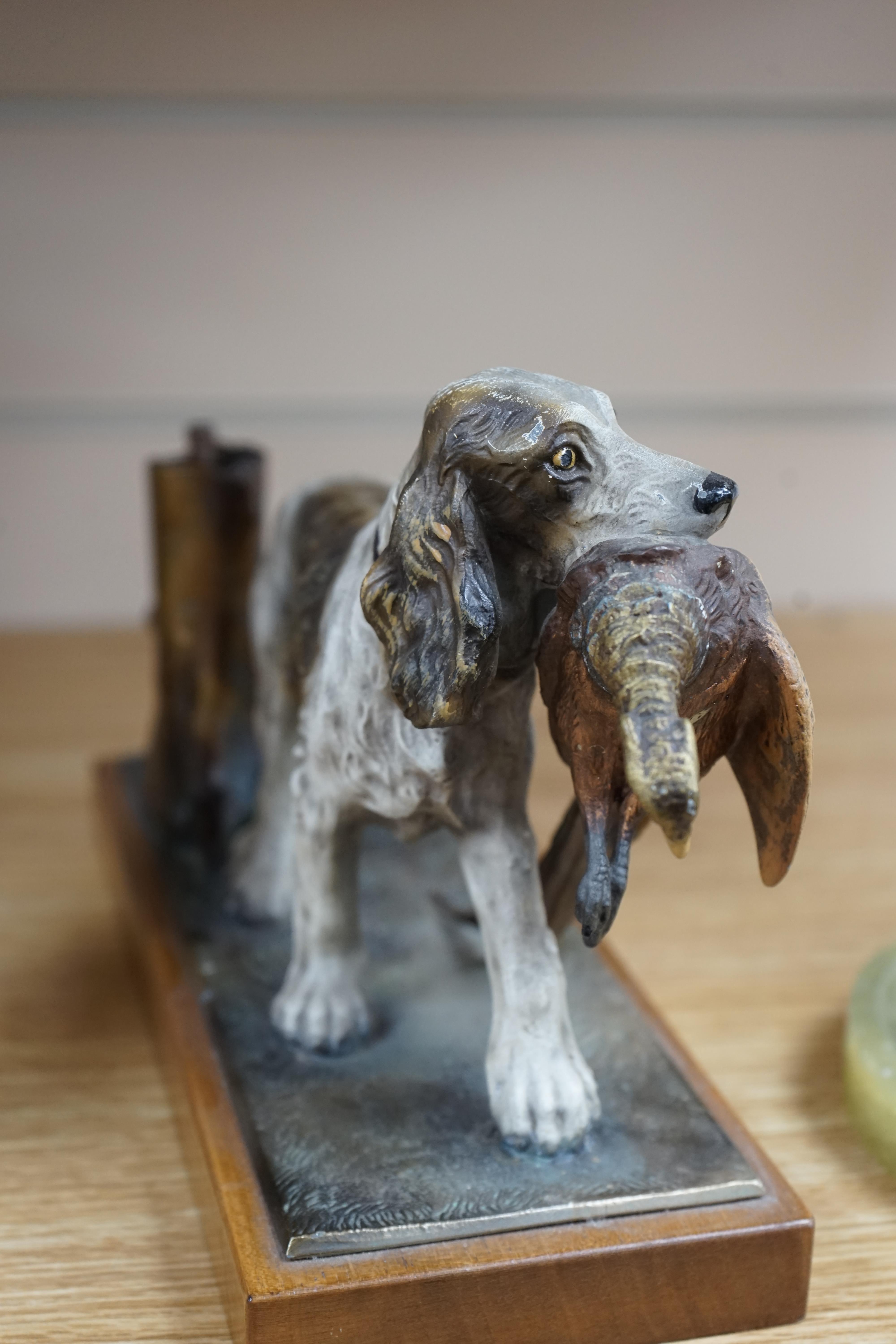 A cold painted bronze and onyx ‘rainbow trout’ ashtray and a painted spelter ‘hunting dog’ table lighter, 27cm. Condition - fair to good